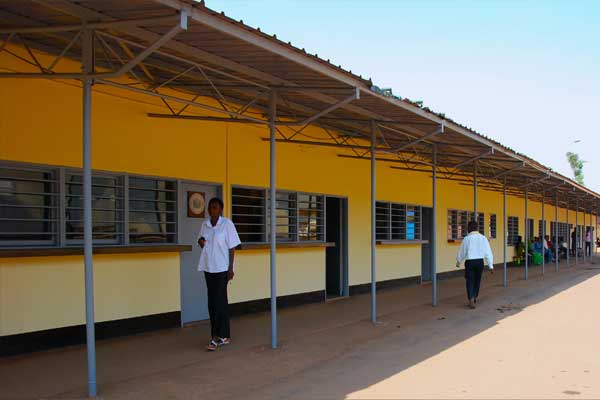 lady walking through building corridor